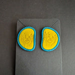 Handcrafted Radiant Sunburst Feminine Women's Day earrings in bold yellow and blue accents