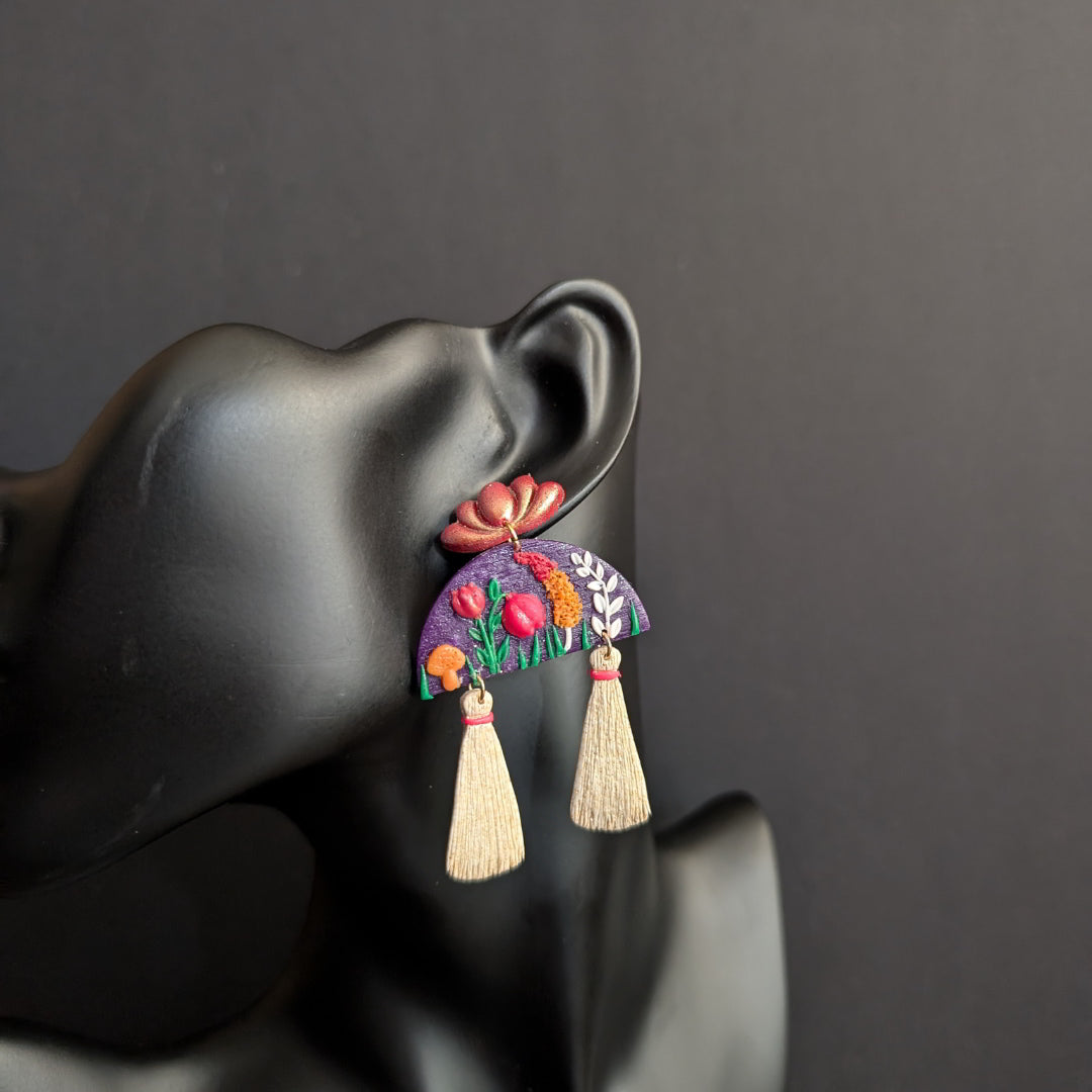 Handmade Blooming Lotus Tassel Earrings with floral accents and tassels.