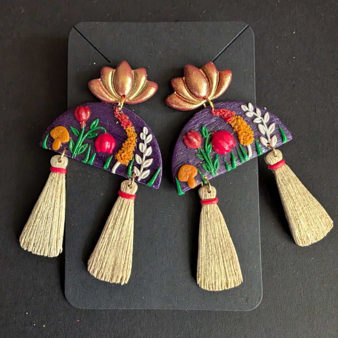 Handmade Blooming Lotus Tassel Earrings with floral accents and tassels.