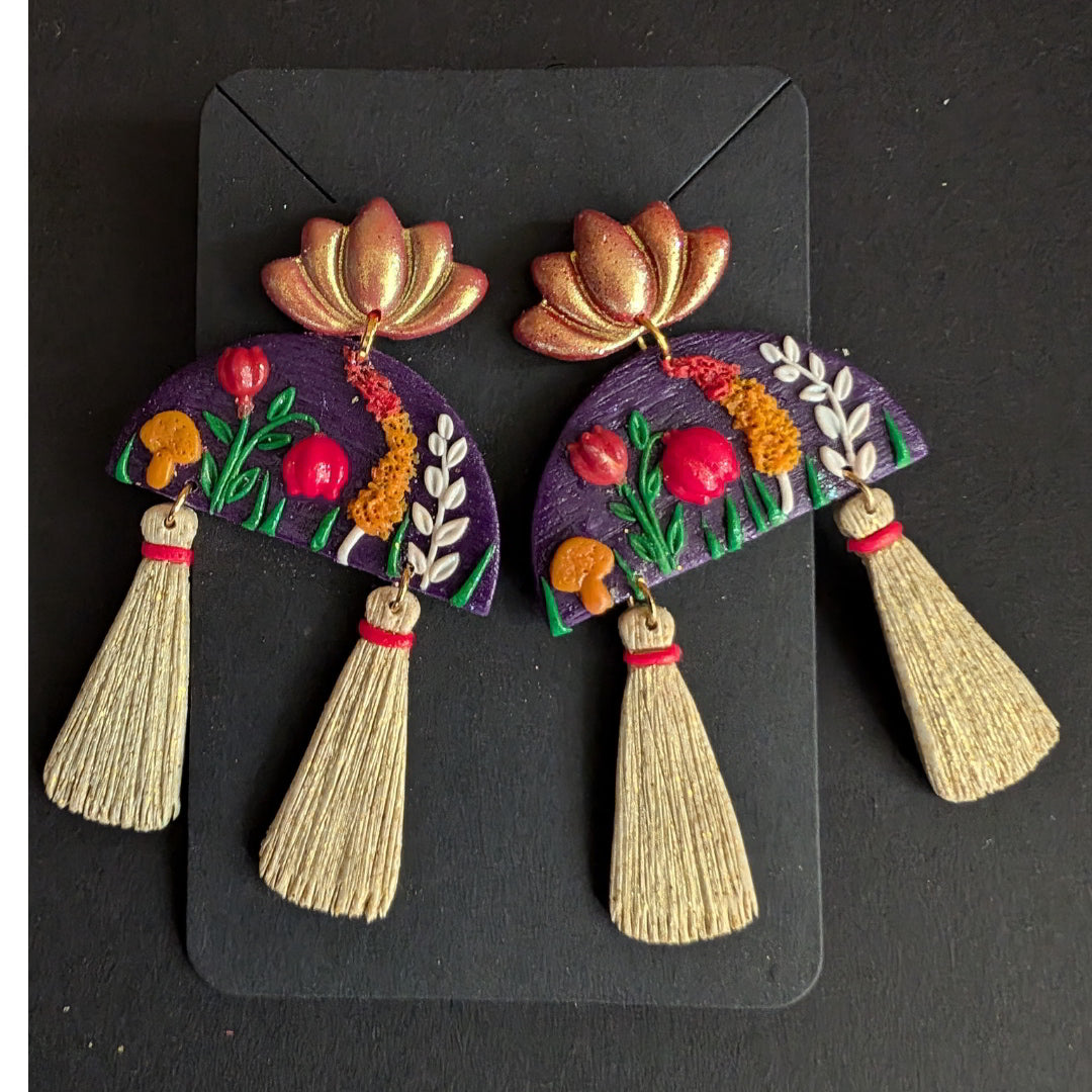 Handmade Blooming Lotus Tassel Earrings with floral accents and tassels.