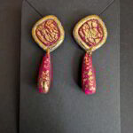 Handmade red and gold textured polymer clay earrings with cracked gold design